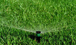 Automatic irrigation system watering lawn