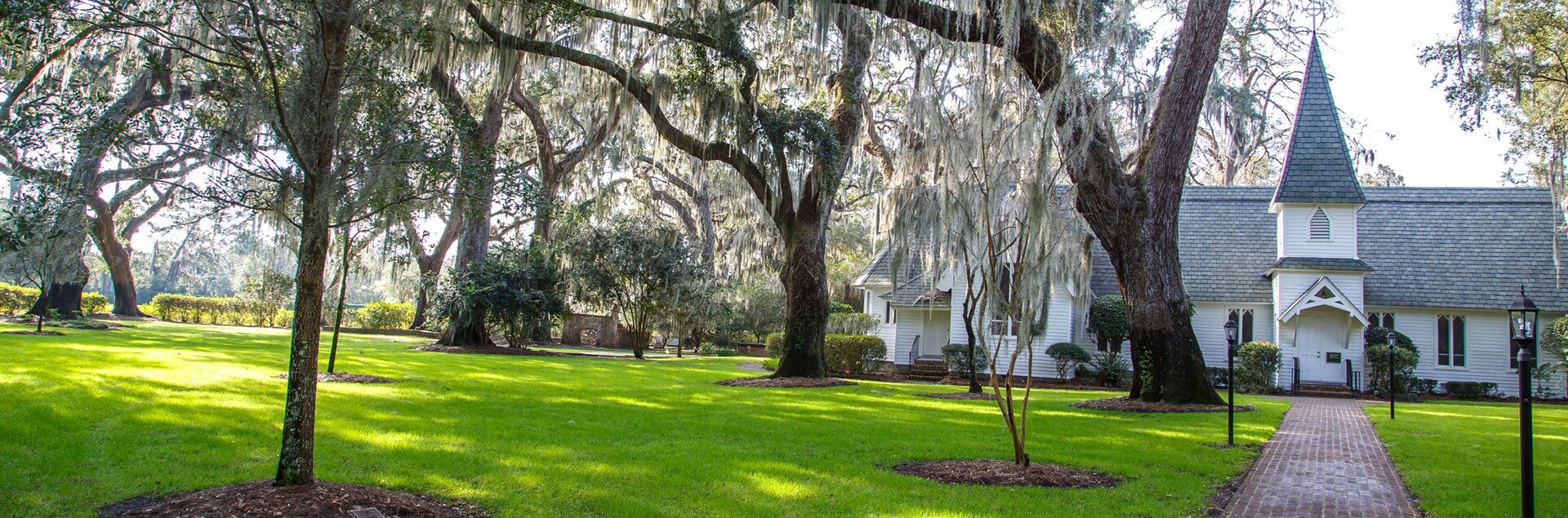 a house with trees and grass