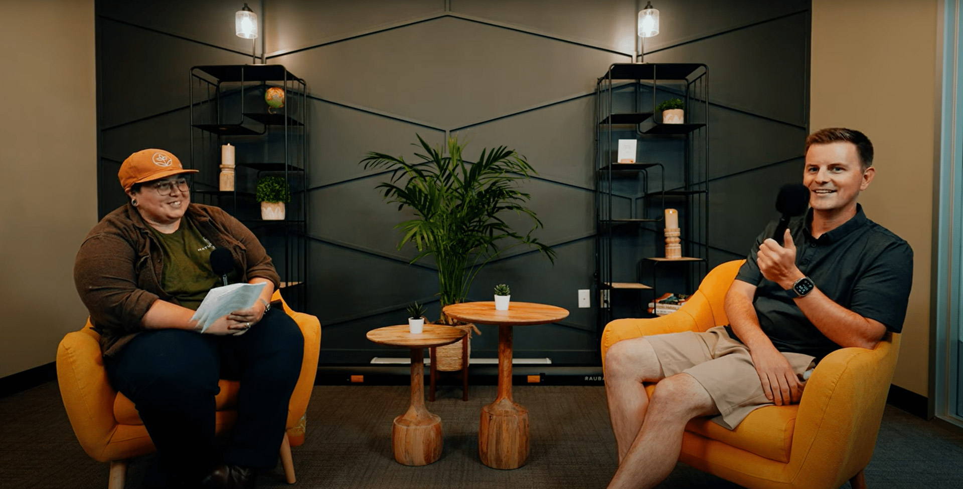 two men sitting in chairs