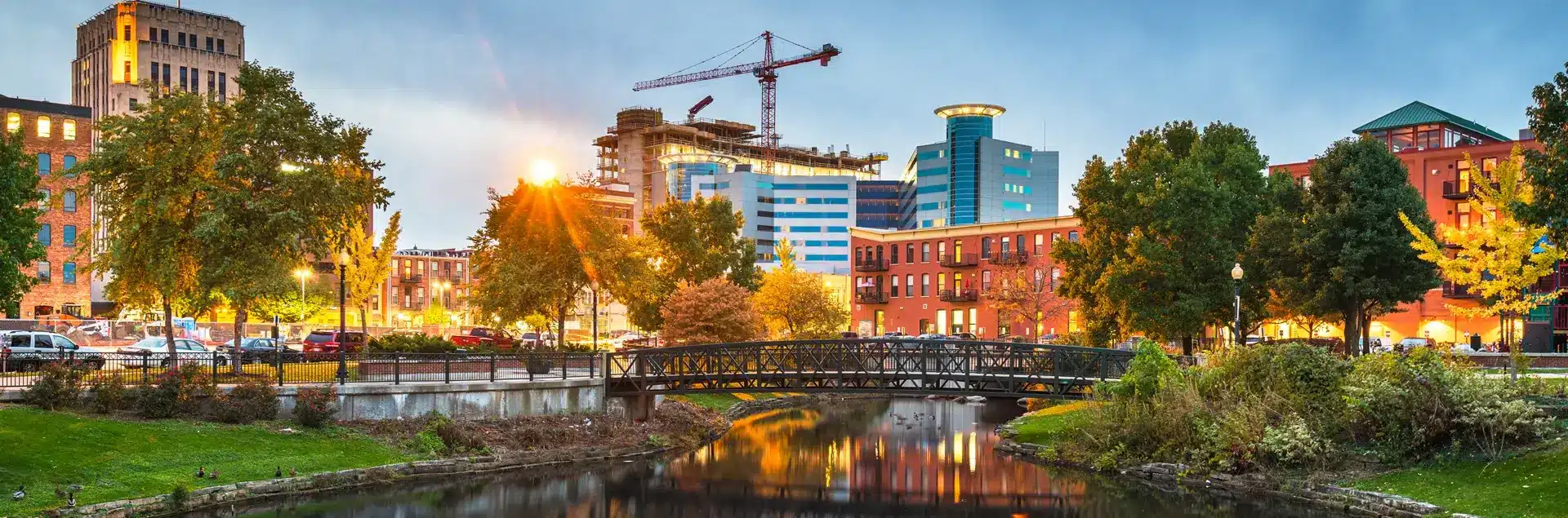 a bridge over a river with buildings in the background